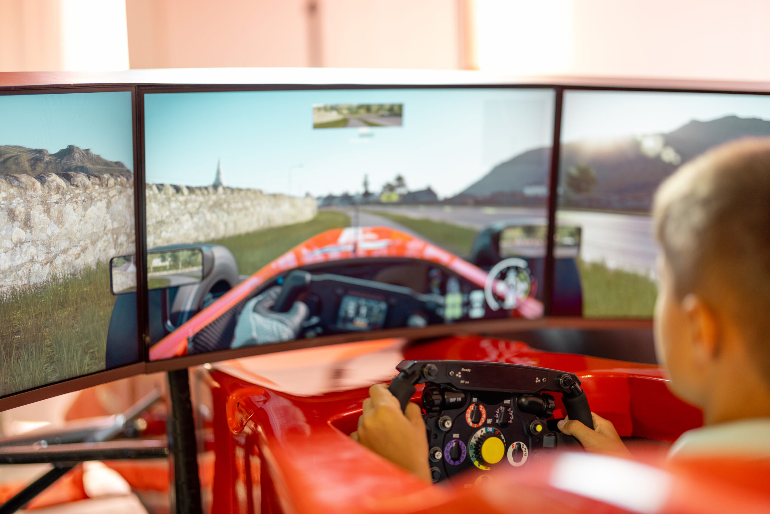 drives a sports car simulator